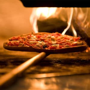 Pizza in the oven at Pi Pizzeria