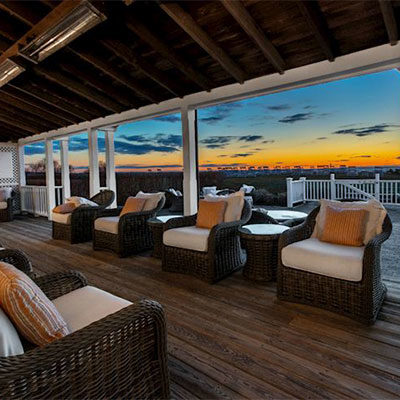 view of the sunset from the porch at The Wauwinet