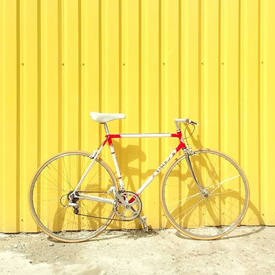 Bike against a yellow wall