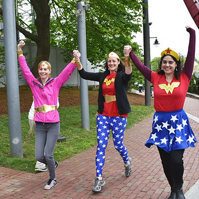 People dressed up as superheroes walking