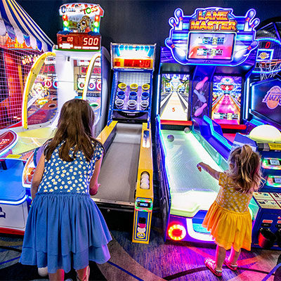 Kids playing arcade games